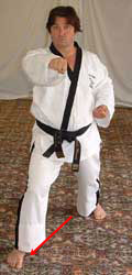 DSCF0222 5) Slide right foot diagonally forwards to form right walking stance while performing a middle section punch towards C with the right forefist