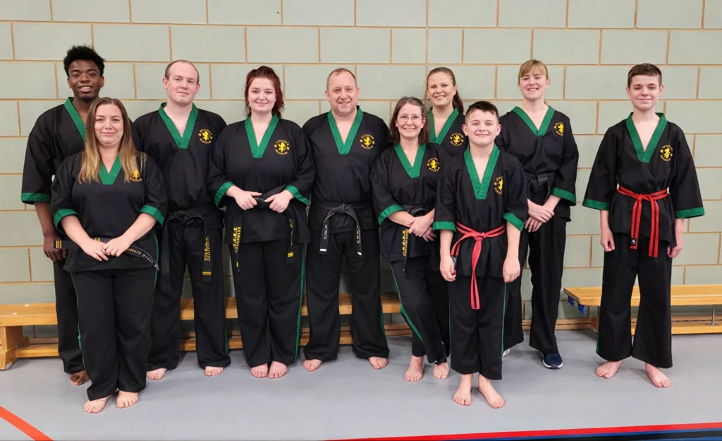A group shows their black Revolution Taekwon Do Doboks