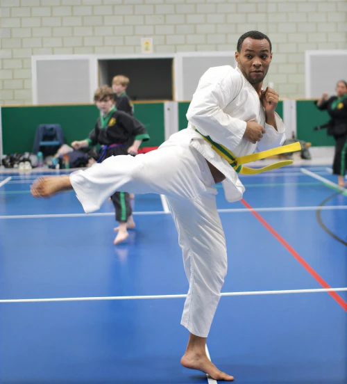 yellow-green-tag-kicks-med A student practices a kick