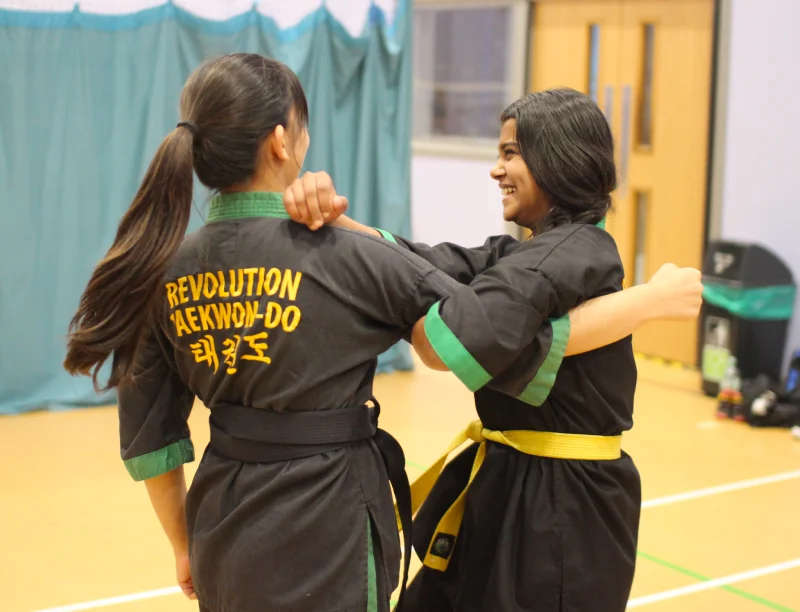 IMG_9735 A yellow belt woman practices an arm lock
