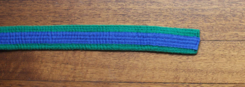 coloured_belt_green_blue_tag Green with blue tag belt