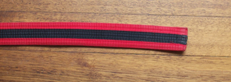 coloured_belt_red_black_tag Red with black tag belt